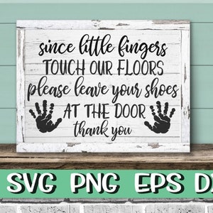 May include: White wooden sign with black text that reads "since little fingers TOUCH OUR FLOORS please leave your shoes AT THE DOOR thank you". The sign has two black handprints on either side of the text.