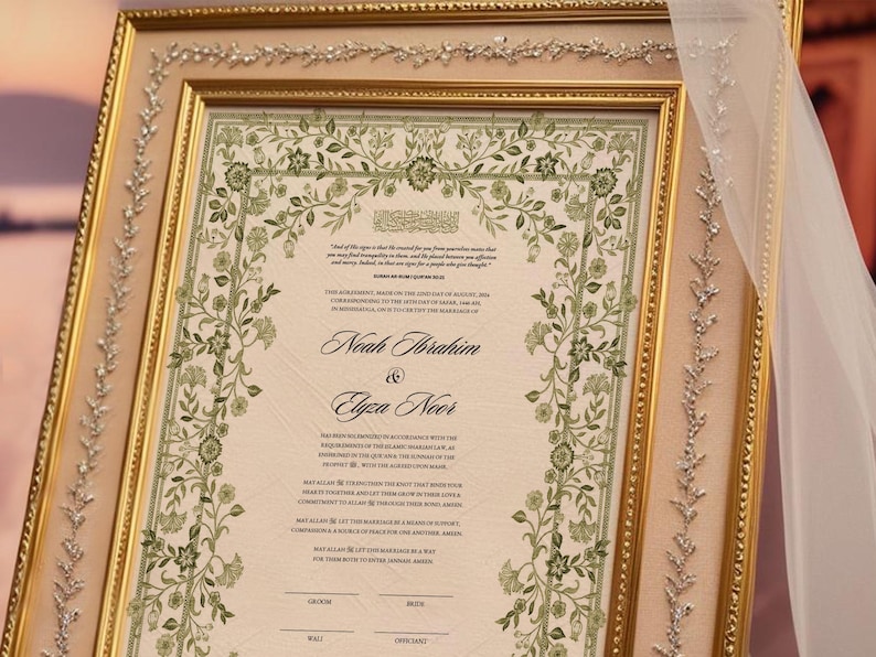 May include: A framed wedding certificate with a floral border in shades of green. The certificate is for Noah Ibrahim and Elyza Noor. The text includes the date of the wedding, August 20, 2023, and the location, Birmingham, Alabama.