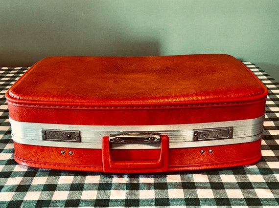red suitcase vintage