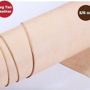 May include: A close-up of a roll of light beige leather, labeled "Veg Tan Leather" and "5/6 oz."