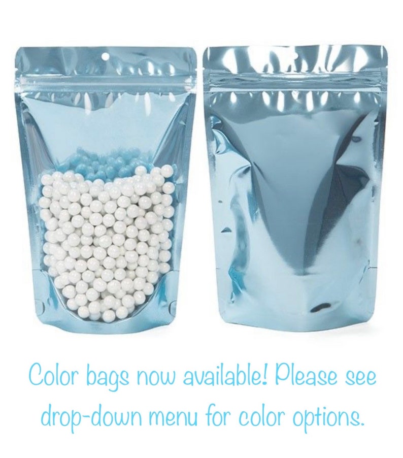 May include: Two light blue stand-up pouches with a zipper closure. One pouch is filled with white round beads. Color bags now available! Please see drop-down menu for color options.