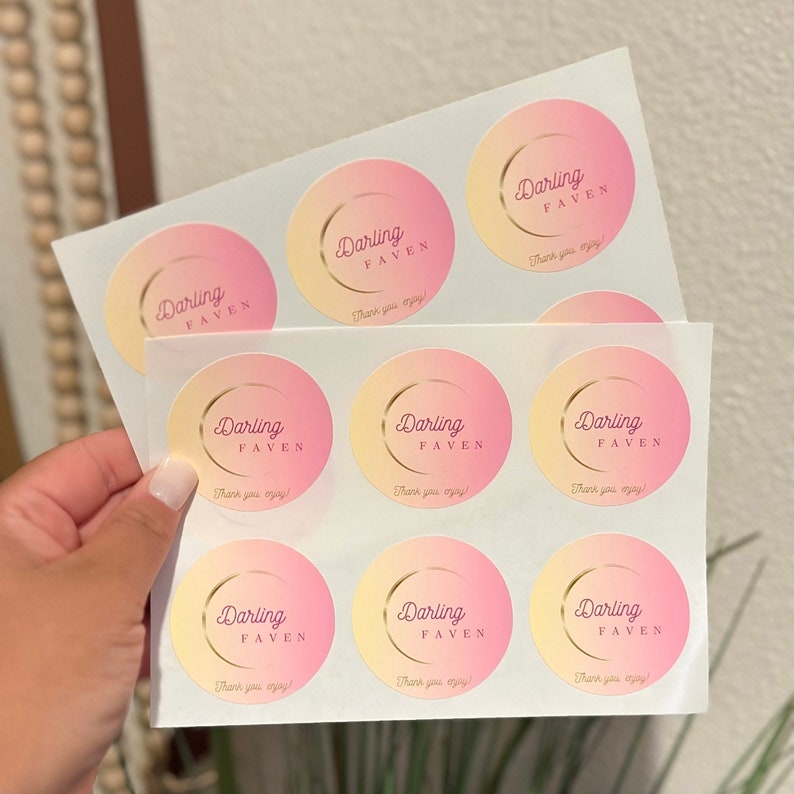 May include: A sheet of pink and yellow gradient round stickers with the text "Darling Faven" and "Thank you enjoy!" printed on each sticker.
