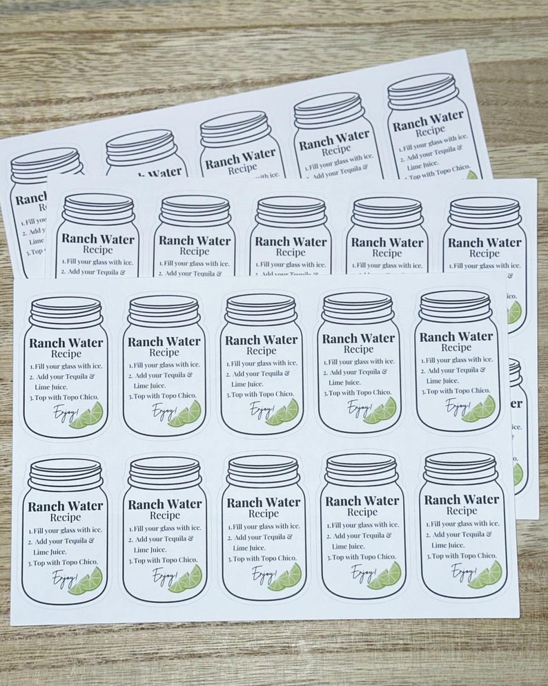 May include: A set of 16 white labels with black outlines of mason jars. Each label has the text "Ranch Water Recipe" and instructions for making the drink. The instructions include filling a glass with ice, adding tequila and lime juice, and topping with Topo Chico.