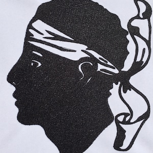 May include: A black and white silhouette of a person's head with a bandanna, facing left, with a scroll behind the head.