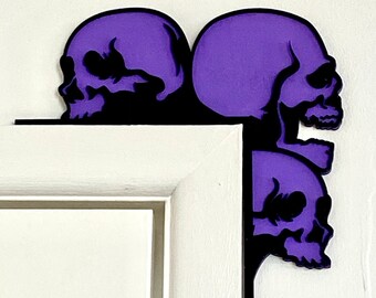 Adornos de puerta con calaveras: decoración de Halloween en capas