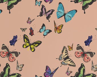 May include: A white desk and chair are in front of a wall covered in a butterfly pattern. The butterflies are in various colors, including blue, yellow, and green. A vase of flowers and a book are on the desk.