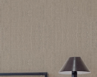 May include: A bedroom scene featuring a bed with white bedding and striped pillows. A black lamp sits on a small wooden side table. The wall is covered in textured wallpaper, and a window is visible.