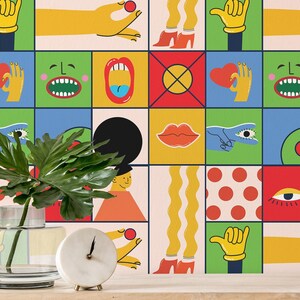 May include: A colorful geometric wallpaper with a repeating pattern of abstract faces, eyes, lips, hands, and geometric shapes. The wallpaper is in shades of red, yellow, green, blue, and black.