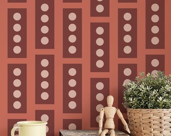 May include: A red and white geometric pattern wallpaper with a wooden mannequin, a yellow mug, a stack of books, a pencil, and a pair of glasses on a white surface. A potted plant with green leaves sits on the surface.