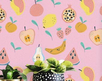 May include: A pink wallpaper with a repeating pattern of fruit and leaves. A framed botanical illustration of a fern is hanging on the wall. The fern is green and has a brown stem. The text "Thelypteris dryopteris" is printed below the fern. A wooden table with two potted plants is in front of the wall.
