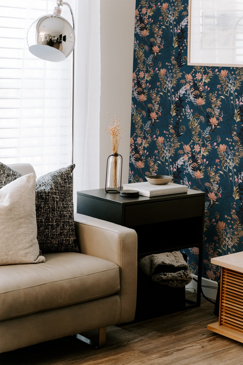 Teal Wildflowers removable wallpaper with scattered flowing stems and blossoms on a deep teal field, living room wall.