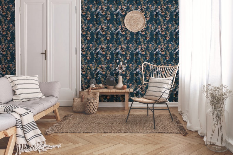 Teal Wildflowers peel and stick wallpaper covers a living room wall with scattered stems and soft blooms on deep teal.