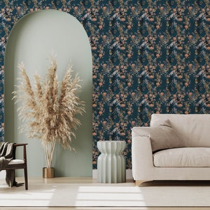Teal Wildflowers peel and stick wallpaper covers a living room wall with dense peach blossoms and fine leafy sprigs.