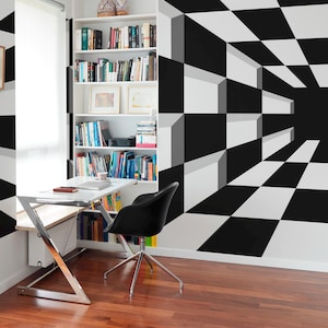 May include: A modern home office with a black and white geometric accent wall. The room features a white desk, a black chair, a bookshelf filled with books, and a hardwood floor. A white ceiling light fixture is also visible.
