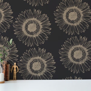 May include: Black and gold wallpaper with a repeating pattern of stylised sunflowers. The sunflowers are outlined in gold and have a black centre.