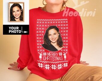 May include: Red Christmas sweater with a white snowflake and reindeer pattern. The sweater features a personalized photo in the center with the text "Merry Christmas".