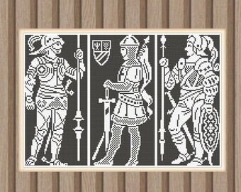 May include: A framed black and white print featuring three medieval figures in armor. The figures are depicted in a pixelated style, each holding a weapon or shield. The print is set against a wooden background.