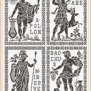 May include: A framed cross-stitch sampler featuring four panels with black and white images of classical figures. The panels include the names Apollo, Diane, Minerva, and Bacchus. The figures are surrounded by decorative borders.