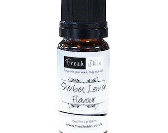 May include: A small brown glass bottle with a black cap. The label is white with black text that reads "Fresh Skin" and "Sherbet Lemon Flavour". The label also says "Ideal For Lip Balms" and "www.freshskin.co.uk".