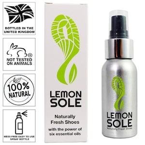 May include: A silver spray bottle with a black nozzle and a green footprint logo. The bottle is labelled "Lemon Sole" and says "Naturally Fresh Shoes with the power of six essential oils".