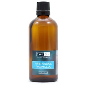 May include: A brown glass bottle with a black cap, labelled "Fresh Skin" and "Christmas Spice Fragrance Oil".