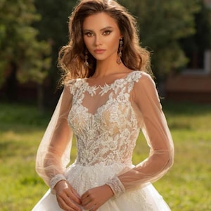 Luxurious Wedding Dress with Corset, Embroidered Lace, Puffy Transparent Tulle Sleeves, and cathedral train