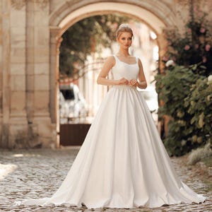 Elegant Satin Wedding Dress with Boned Corset, Straps, Full Skirt & Train