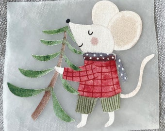 May include: A white mouse with red and black plaid clothing holds a green Christmas tree branch. The mouse is on a clear background.
