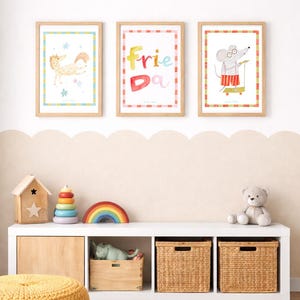 May include: Three framed watercolor prints with animal illustrations and the word "Friend" in colorful letters. A white shelf holds toys, including a wooden house, a rainbow, and a teddy bear. A yellow pouf and a round rug complete the scene.