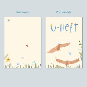 May include: Two-page illustrated card with a cream background. The front features the text "U-Heft" in blue and yellow, and two dachshunds wearing hats. The back has a butterfly and a small red bird.