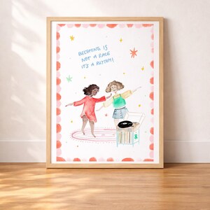 May include: Watercolor art print in a wooden frame. The artwork features two dancing figures, a record player, and the text "Becoming is not a race it's a rhythm!" The border has a pink and red dotted design with stars.