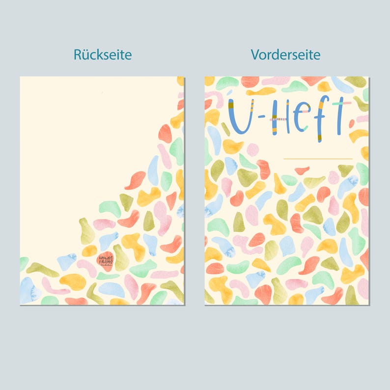 May include: A colorful notebook cover with a light yellow background and a pattern of abstract shapes in shades of pink, blue, green, and orange. The front cover has the text "U-Heft" in blue and yellow.