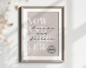 May include: Framed print with the words "NOW AND FOREVER" in large, light-colored letters. The names "Amanda" and "Jackson" are written in cursive. A stamp that says "London Engaged" is at the bottom.