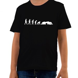May include: Black t-shirt featuring a white graphic of the evolution of man, culminating in a group of people in a rugby scrum.