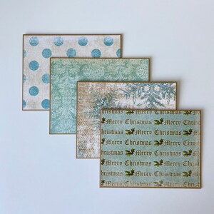 May include: Set of four Christmas cards with a vintage aesthetic. The cards feature a variety of patterns, including polka dots, snowflakes, and a repeating pattern of "Merry Christmas" in a vintage font.