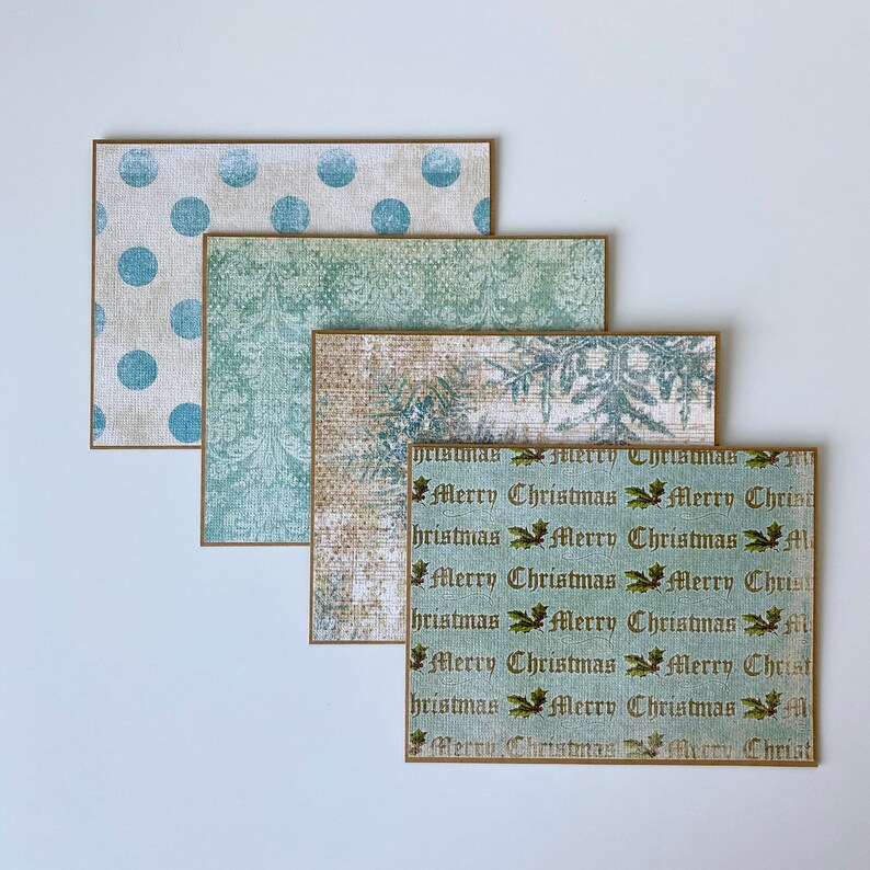 May include: Set of four Christmas cards with a vintage aesthetic. The cards feature a variety of patterns, including polka dots, snowflakes, and a repeating pattern of "Merry Christmas" in a vintage font.