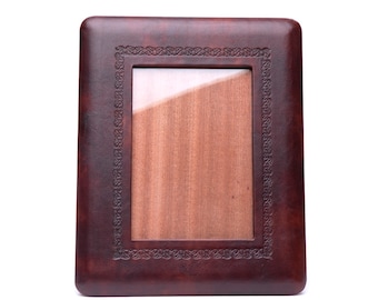 Leather frame decorated with frieze