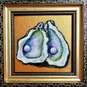 May include: A framed painting of two open oyster shells with iridescent purple, green, and white interiors, each containing a single white pearl. The artwork is set against a metallic gold background and enclosed in a decorative dark brown and gold frame.