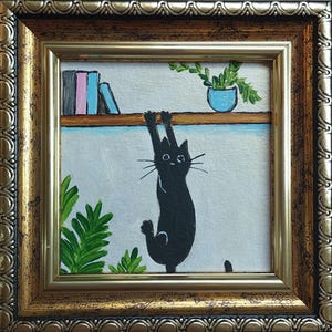 Miniature black cat painting Framed original art Funny cute kitten hand painted Playful cat climbs on the shelf