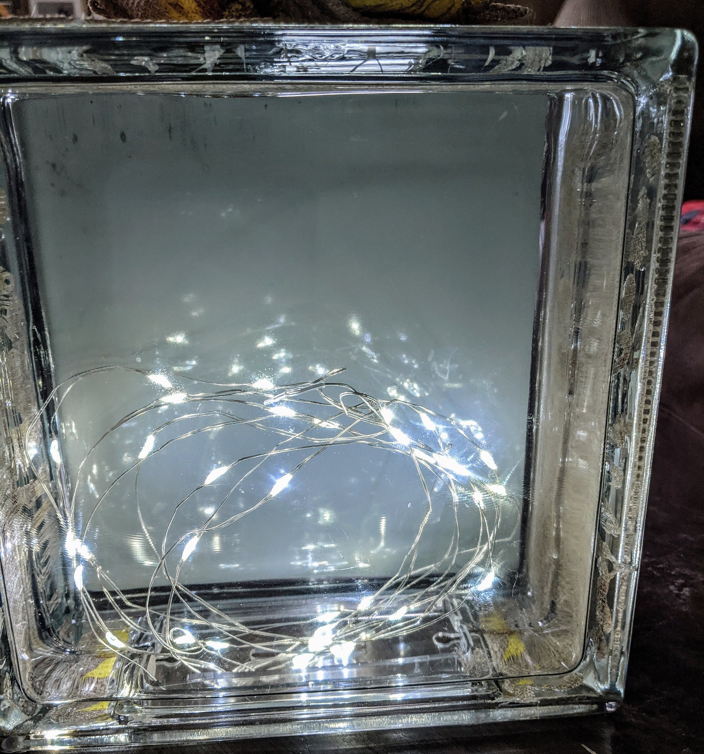 A Battery Fairy Light Glass Block of a Picture of Field on Sun Flowers