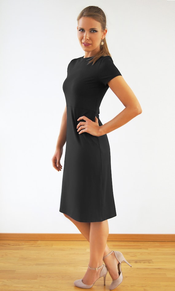black dress and tan heels White with grey and black line stripe shirt