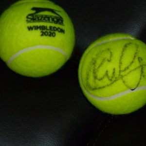 KIM CLIJSTERS autographed Wimbledon tennis ball with Certificate of Authenticity. Also included free is a handmade plastic ball stand.