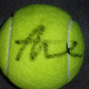 ANA IVANOVIC Autographed tennis ball with COA and free hand made plastic ball holder