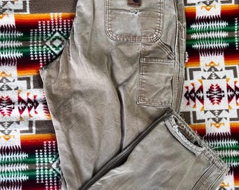 Pantalones de trabajo Carhartt vintage de lona con forro de franela, fabricados en EE. UU.