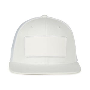 May include: White trucker hat with a white patch on the front. The hat has a mesh back.