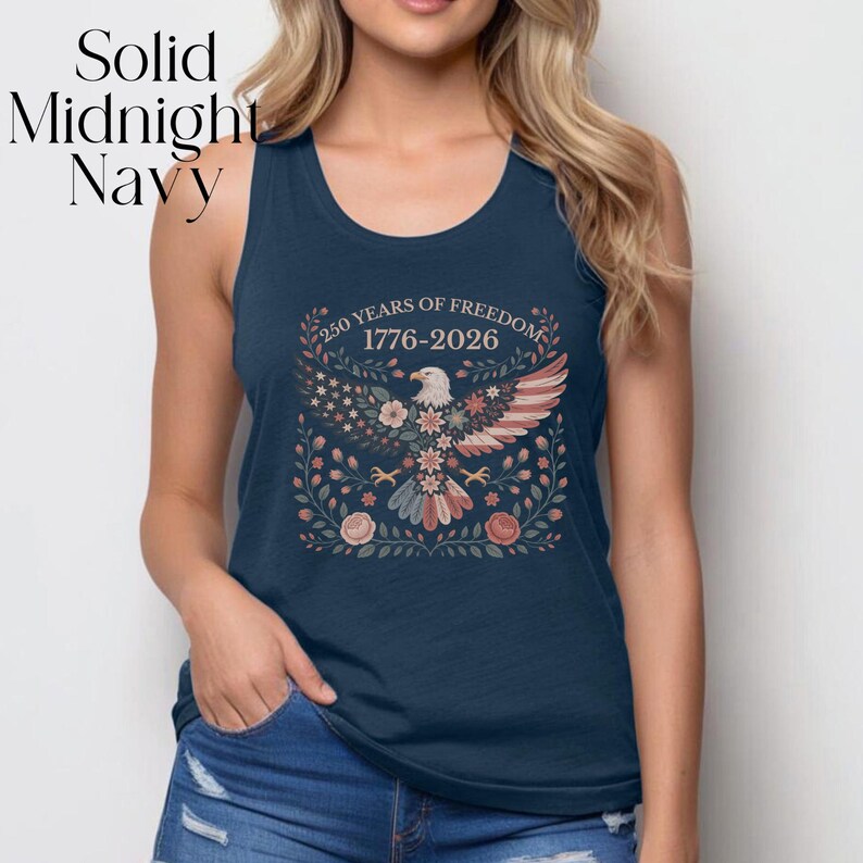 May include: Solid Midnight Navy tank top with a patriotic design. The graphic features an eagle with the text "250 YEARS OF FREEDOM 1776-2026" in a floral wreath. The tank top is sleeveless and made of a soft material.