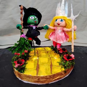 Elphaba and Glinda, Wicked , wicked witches, good and evil witches, miniature wizard of Oz witches, defying gravity