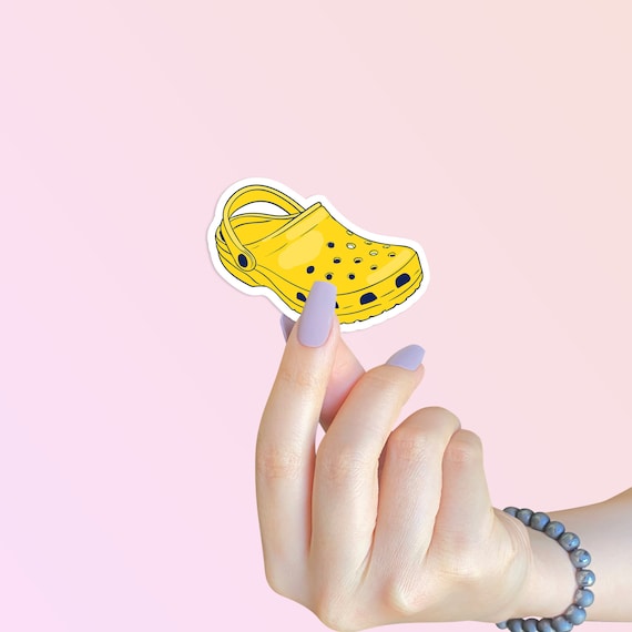 yellow crocs with stickers