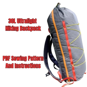 May include: A 30L ultralight hiking backpack with a grey main body, a bright orange vertical zip, red webbing attachment points, and yellow bungee cord lacing. The text 30L Ultralight Hiking Backpack and PDF Sewing Pattern And Instructions is visible.