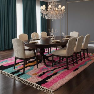 May include: A formal dining room with a large oval table set for a meal. Eight upholstered chairs surround the table, which is set on a colorful rug. Teal curtains and a crystal chandelier complete the elegant setting.